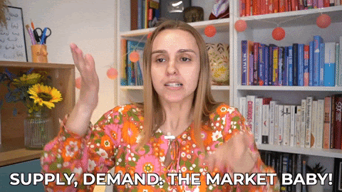 Gif image of a hippie looking woman waving arms around with text overlay reading: Supply, Demand, the Market Baby